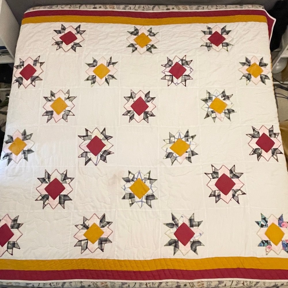 Handmade Star Pattern Quilt with Red and Yellow Accents